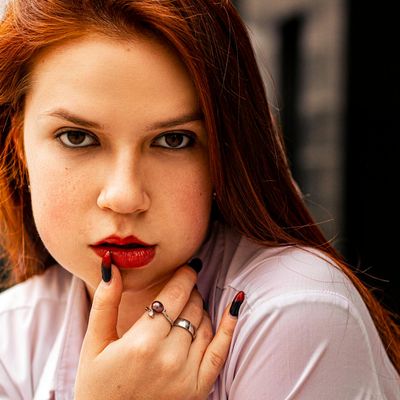 Person resting hands on a desk in a calm posture.